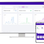 Two screens with the TRAXSuite dashboard open on each device