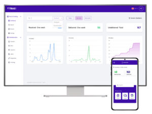 Two screens with the TRAXSuite dashboard open on each device